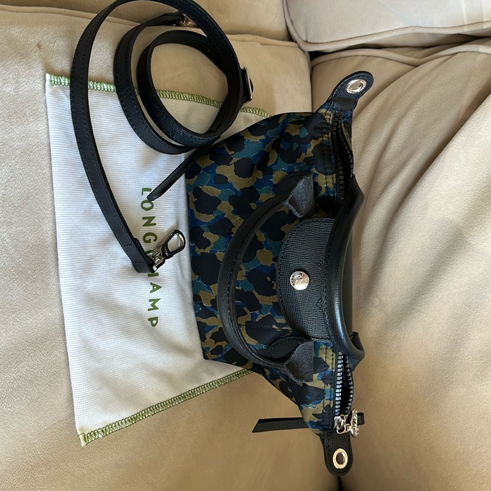 Authentic Longchamp Le Pliage Neo Extra Small with leather trim.